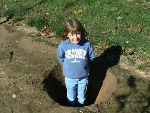 Paul's Turf and Tree Nursery​ Little Girl In Tree Hole